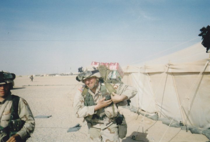 At a camp in Kuwait, carrying sodas to boost morale with the platoon!